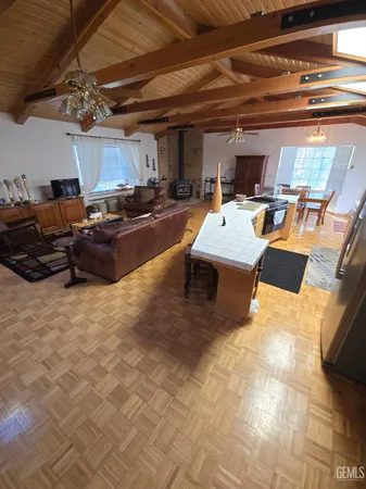 a view of a patio with a table chairs and a bed