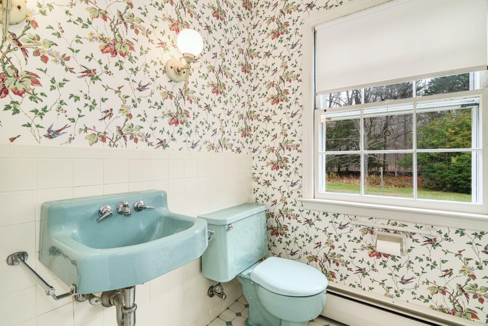 113 Logan Road New Canaan, CT 06840 - Photo 13 of 27 a bathroom with a toilet and a sink