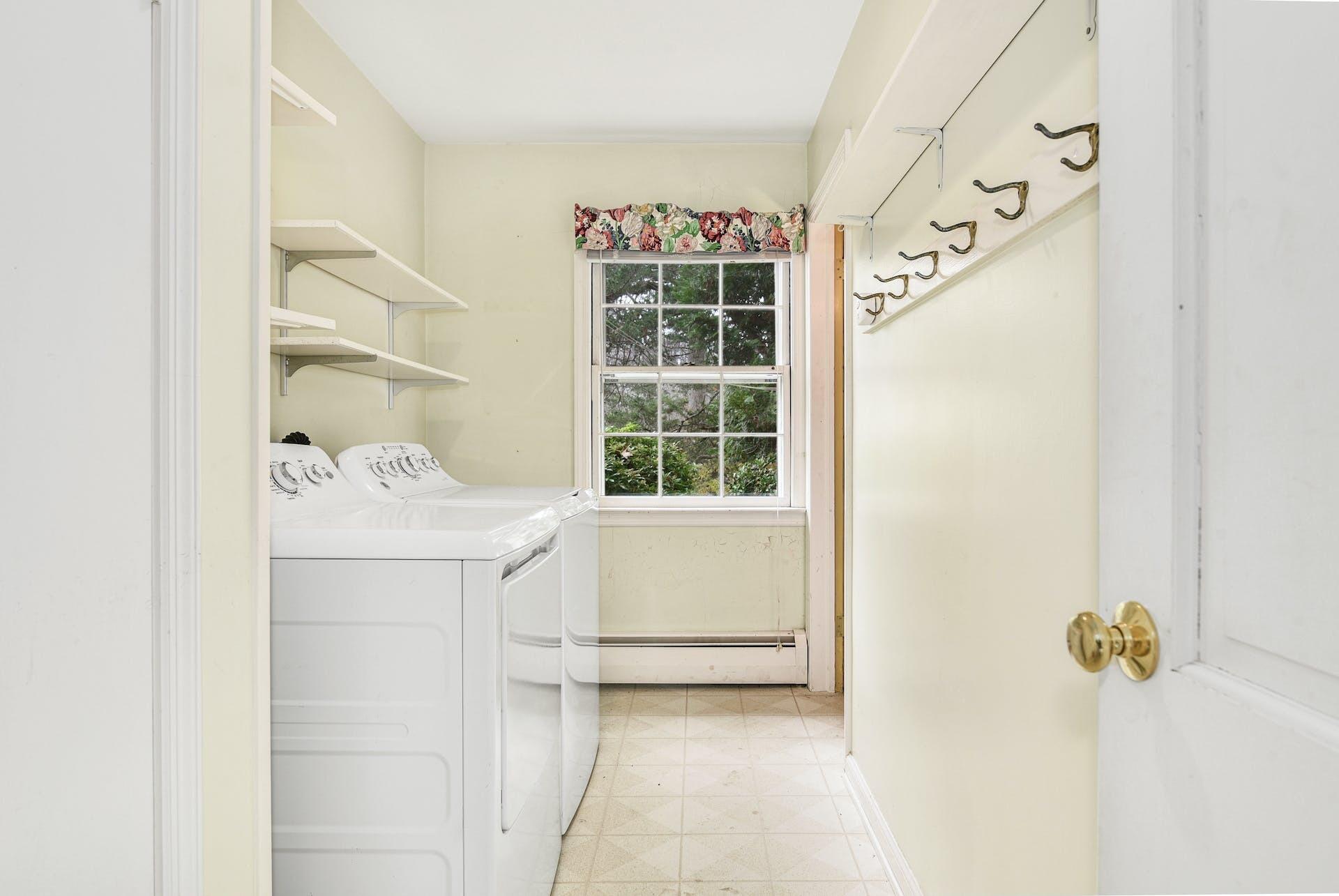 113 Logan Road New Canaan, CT 06840 - Photo 14 of 27 a bathroom with a tub sink and mirror
