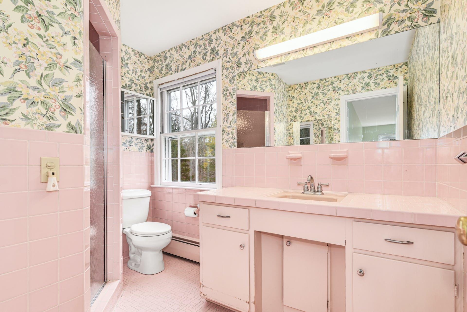 113 Logan Road New Canaan, CT 06840 - Photo 17 of 27 a bathroom with a granite countertop sink a toilet and a large mirror