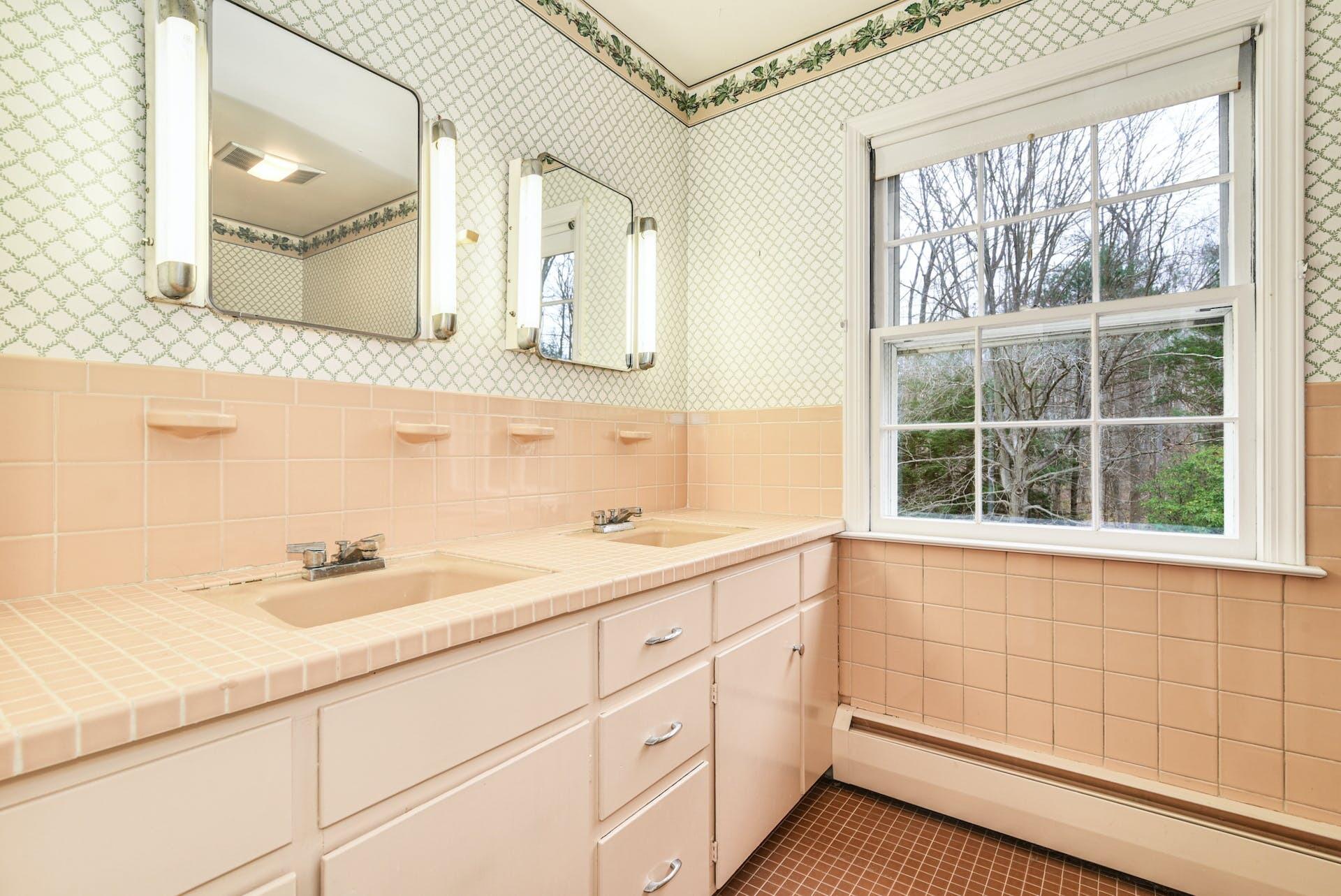 113 Logan Road New Canaan, CT 06840 - Photo 19 of 27 a bathroom with a sink and a mirror
