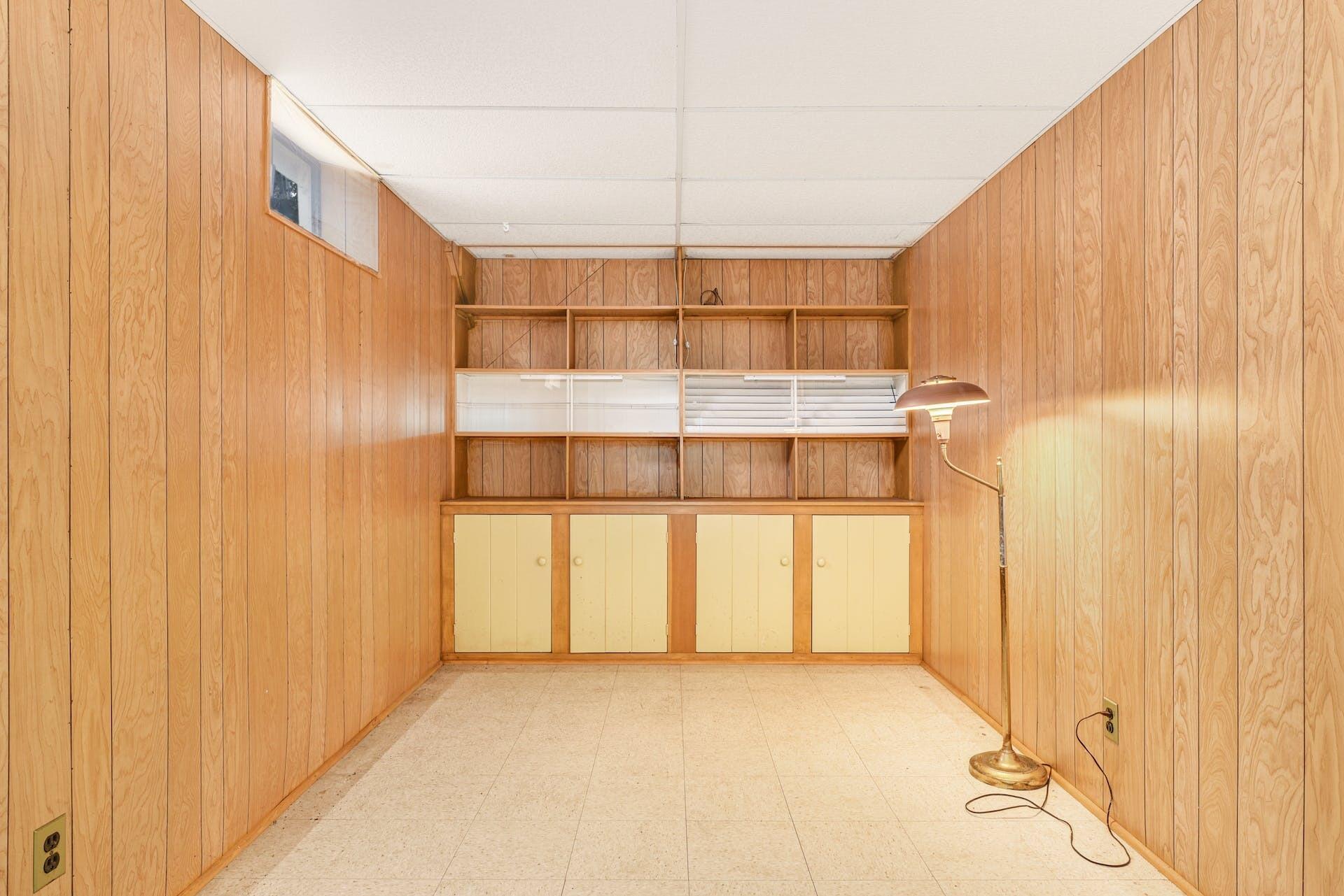 113 Logan Road New Canaan, CT 06840 - Photo 24 of 27 a view of a room with a window and wooden walls