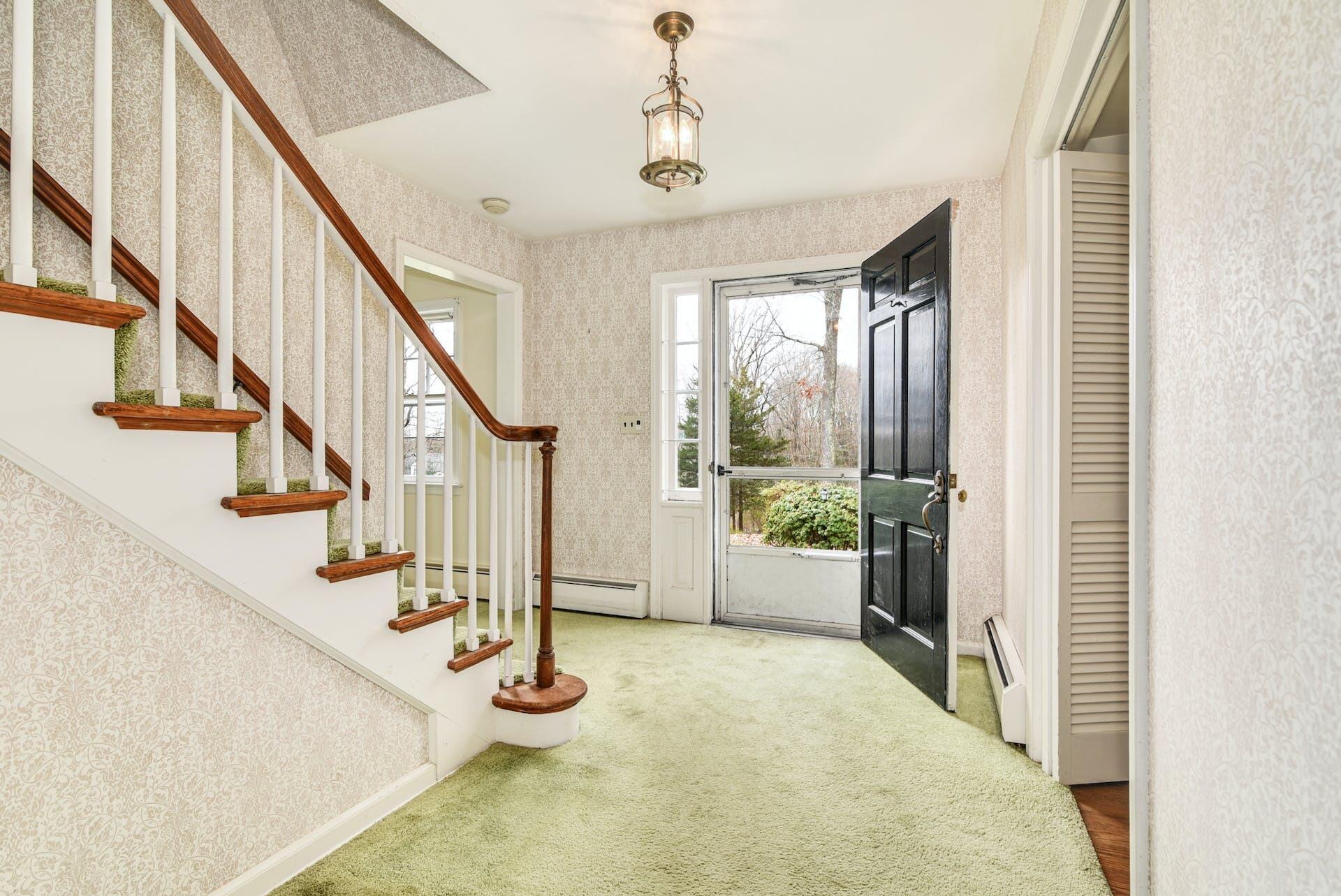 113 Logan Road New Canaan, CT 06840 - Photo 3 of 27 a view of entryway and hall with wooden floor