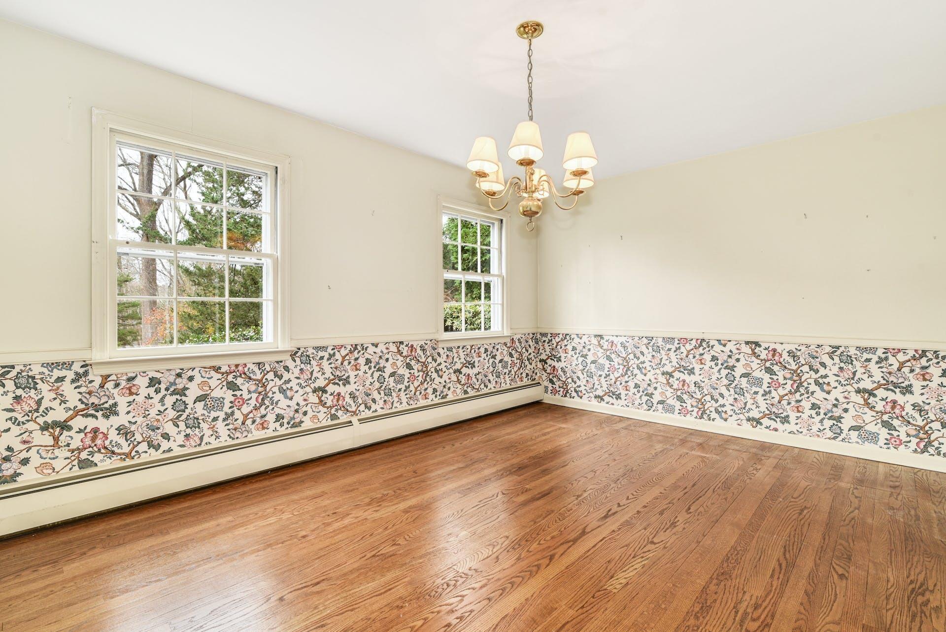 113 Logan Road New Canaan, CT 06840 - Photo 6 of 27 a view of an empty room with wooden floor and a window