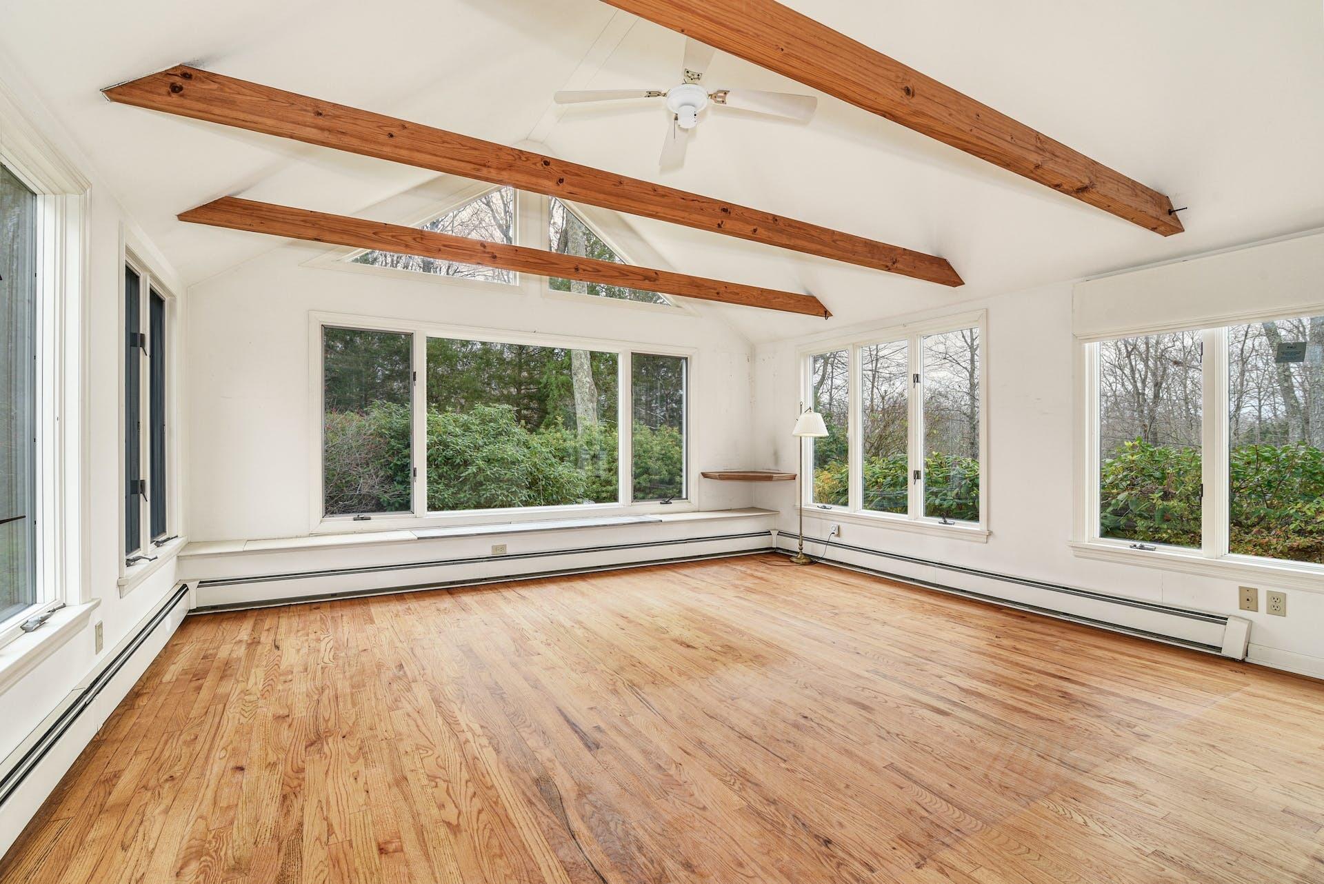 113 Logan Road New Canaan, CT 06840 - Photo 10 of 27 a view of an empty room with wooden floor and a window