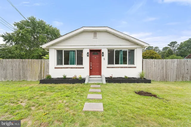 a front view of a house with yard