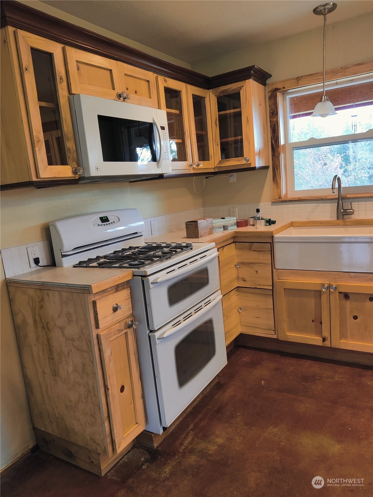 18142 Peter Burns Road Mount Vernon, WA 98274 - Photo 3 of 39 a kitchen with stainless steel appliances a stove microwave and cabinets