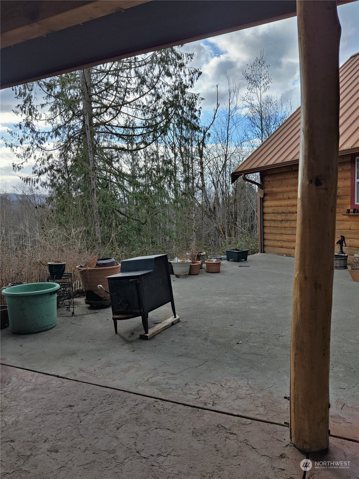 18142 Peter Burns Road Mount Vernon, WA 98274 - Photo 35 of 39 a backyard of a house with outdoor seating
