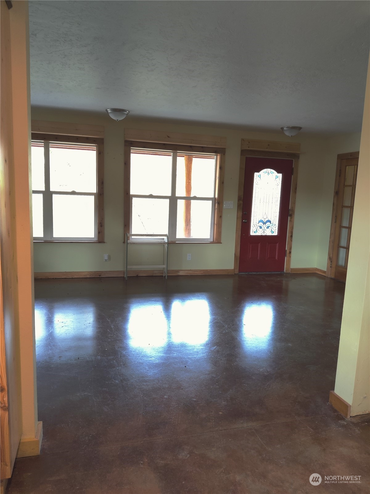 18142 Peter Burns Road Mount Vernon, WA 98274 - Photo 7 of 39 an empty room with wooden floor and windows