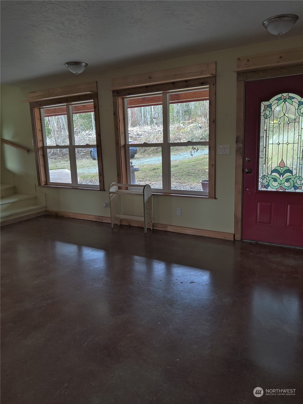 18142 Peter Burns Road Mount Vernon, WA 98274 - Photo 8 of 39 an empty room with wooden floor and windows