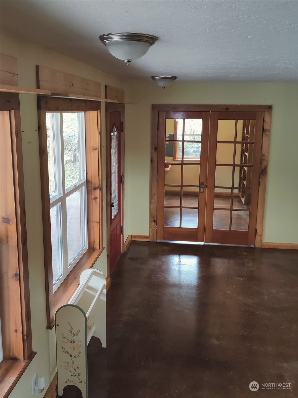 18142 Peter Burns Road Mount Vernon, WA 98274 - Photo 9 of 39 an empty room with wooden floor and windows