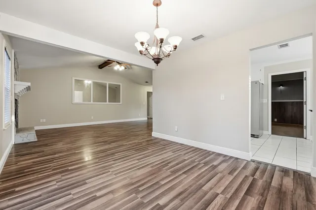 a kitchen with stainless steel appliances granite countertop a refrigerator sink and cabinets