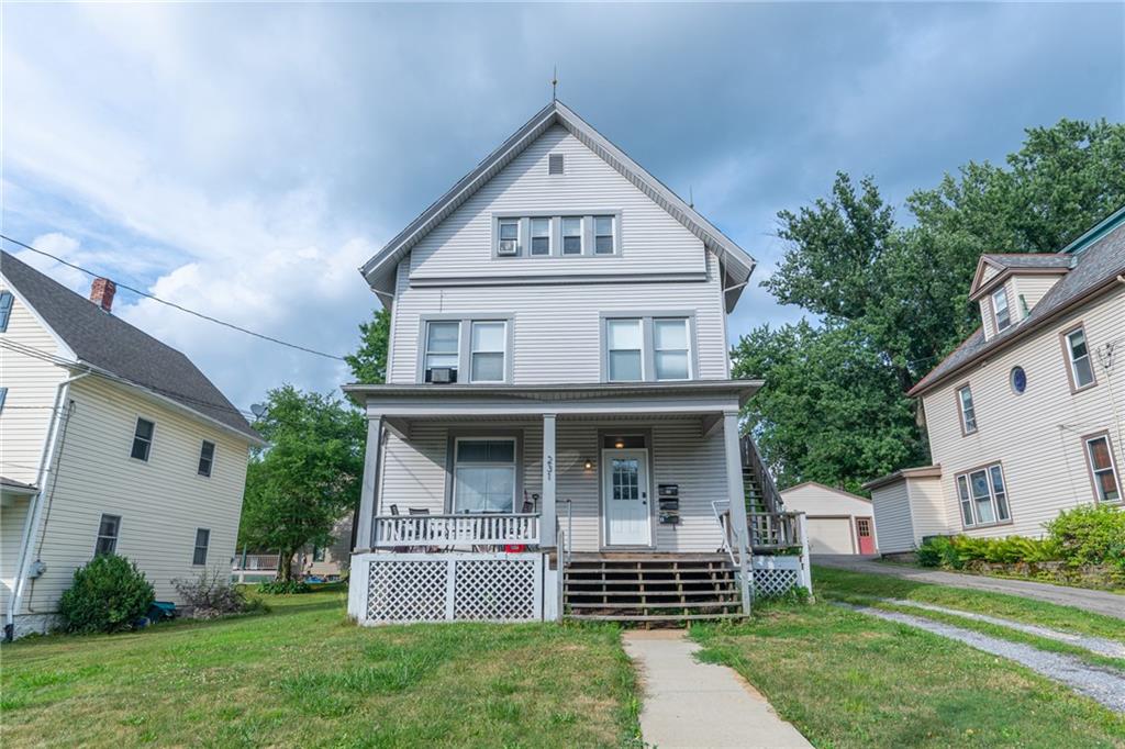 front view of a house with a yard