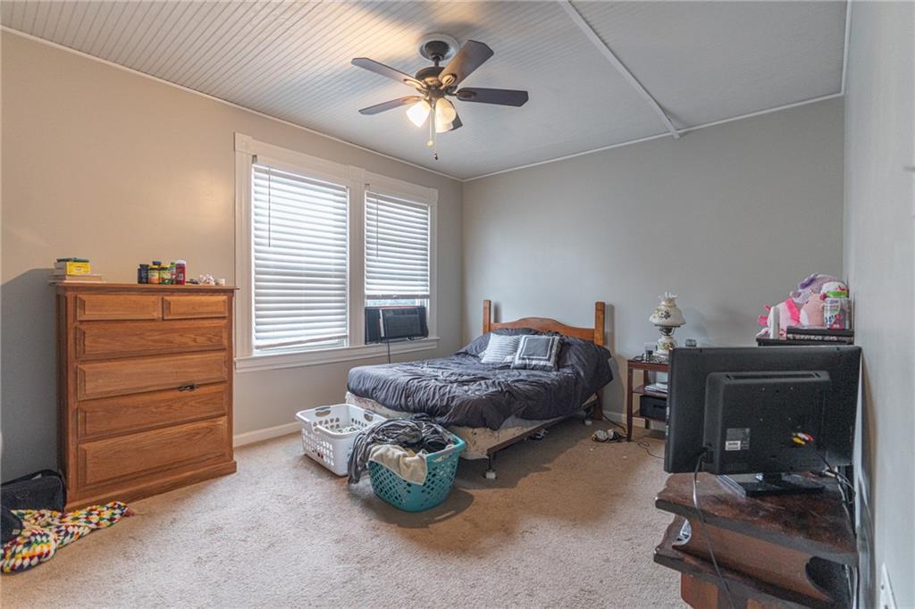 231 Maple Street Slippery Rock, PA 16057 - Photo 11 of 22 a living room with furniture and a chandelier