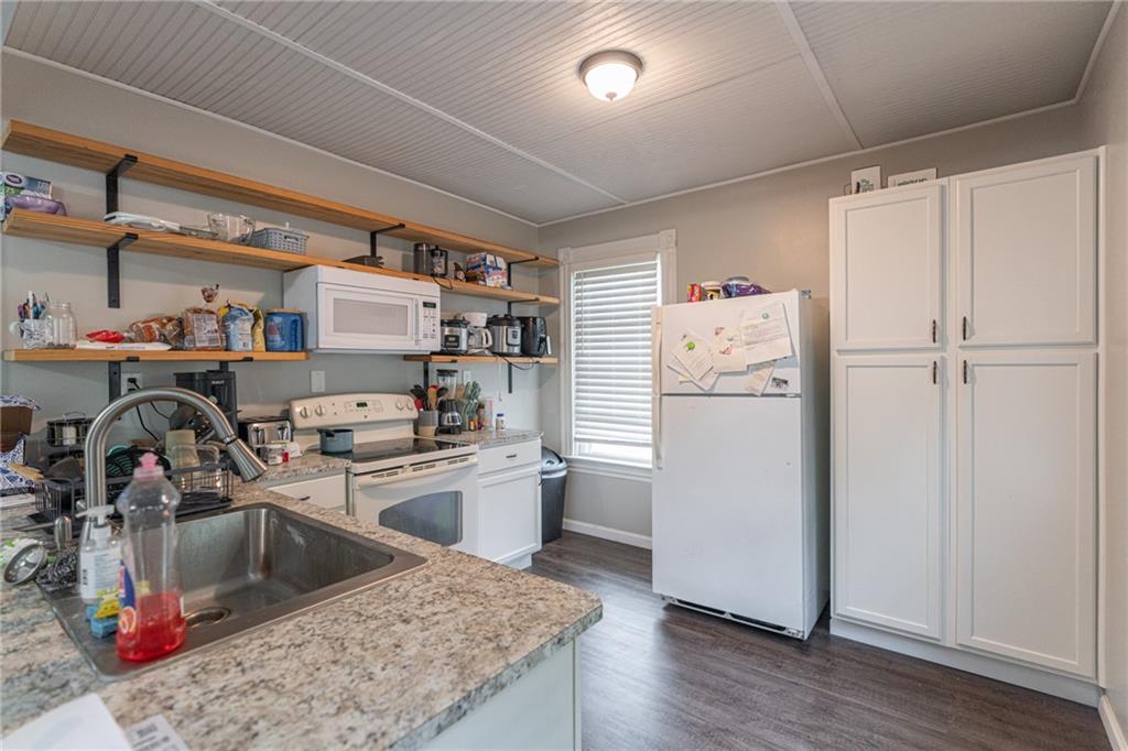 231 Maple Street Slippery Rock, PA 16057 - Photo 13 of 22 a kitchen with a sink cabinets and stainless steel appliances