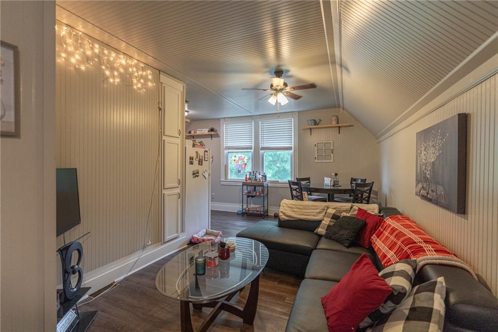 231 Maple Street Slippery Rock, PA 16057 - Photo 16 of 22 a living room with furniture chandelier and a flat screen tv
