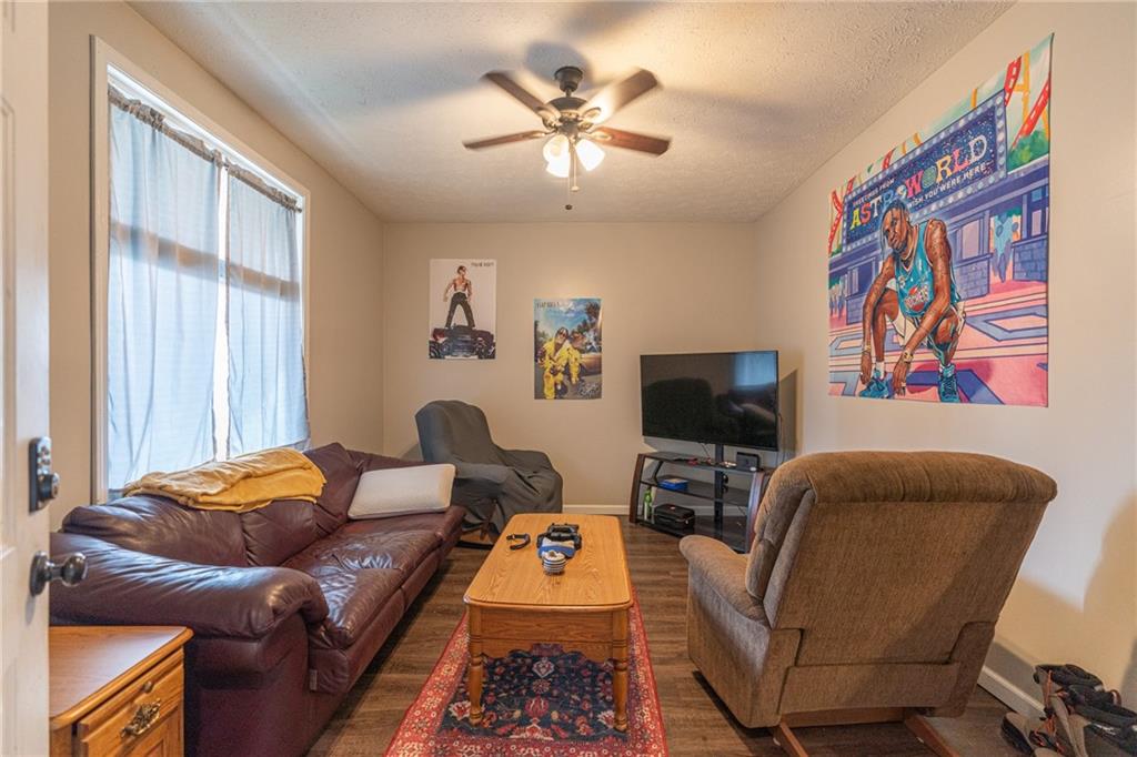231 Maple Street Slippery Rock, PA 16057 - Photo 2 of 22 a living room with furniture and a flat screen tv