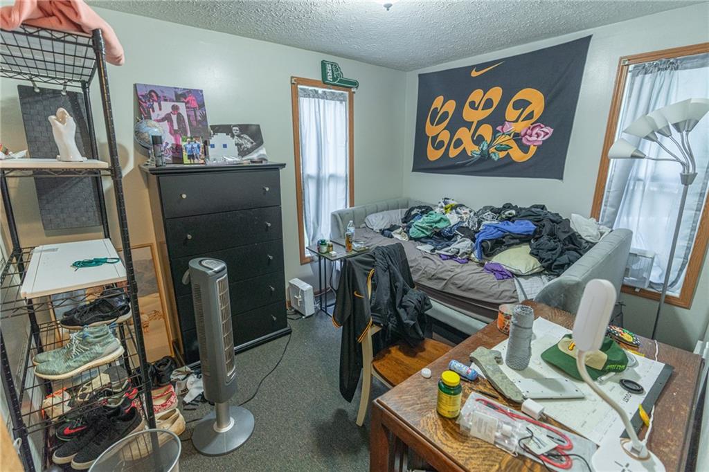231 Maple Street Slippery Rock, PA 16057 - Photo 8 of 22 a living room with furniture and painting on the wall