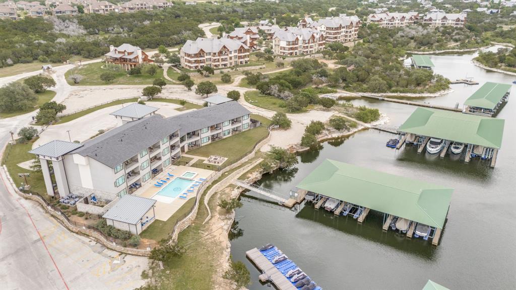 3412 Scenic Point Road, Unit 102 Graford, TX 76449 - Photo 26 of 31 an aerial view of residential houses with outdoor space