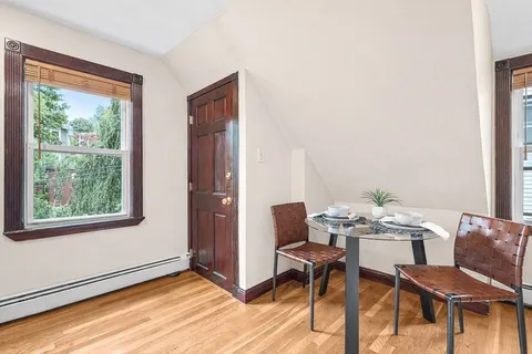 a view of a dining room with furniture window and outside view