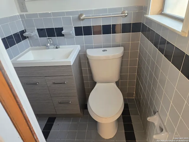 a bathroom with a toilet and a sink