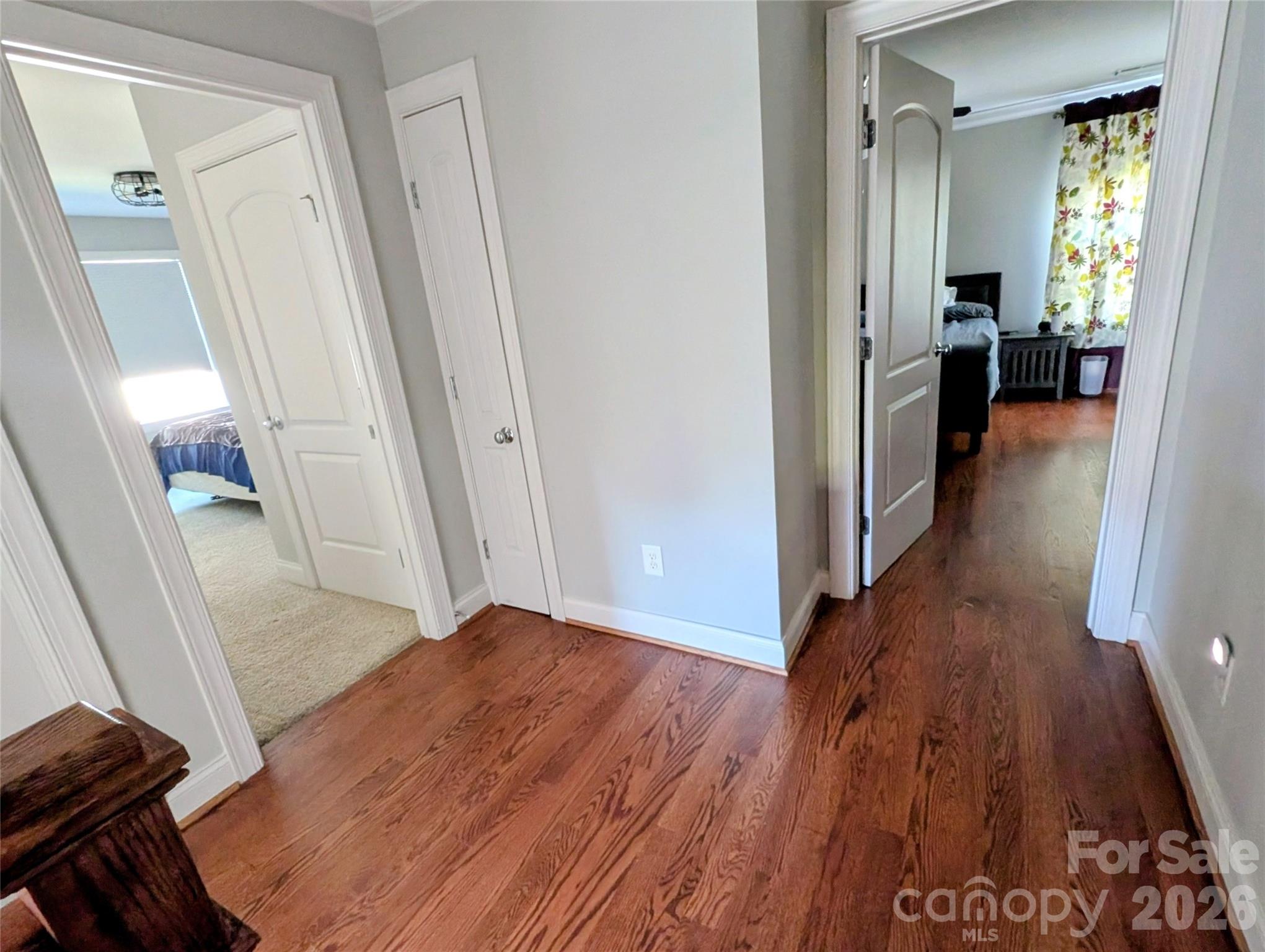 19934 Walter Henderson Road Cornelius, NC 28031 - Photo 21 of 35 a view of a hallway with wooden floor and staircase
