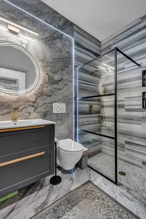 a bathroom with a toilet and a window