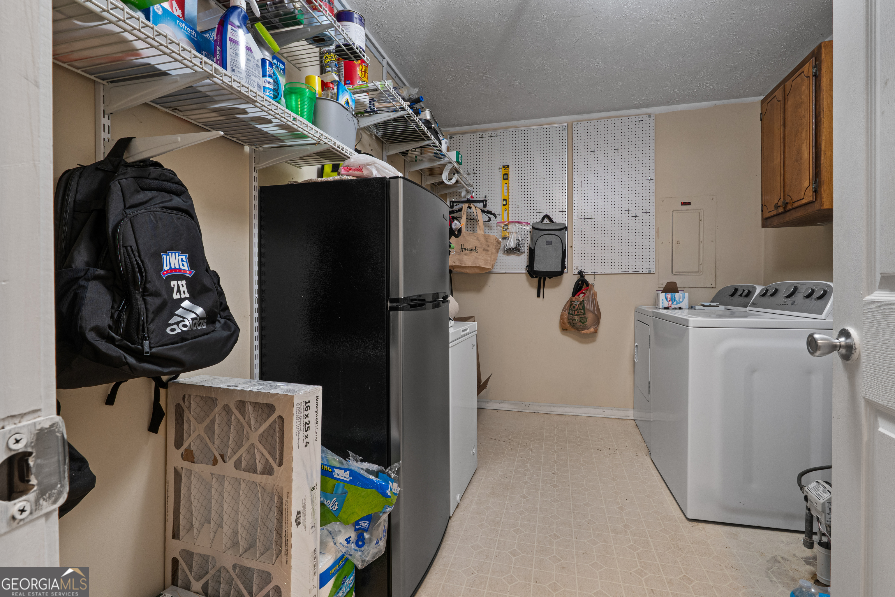 861 Bonner Road Carrollton, GA 30117 - Photo 13 of 38 a view of walk in closet with clothes and shoes