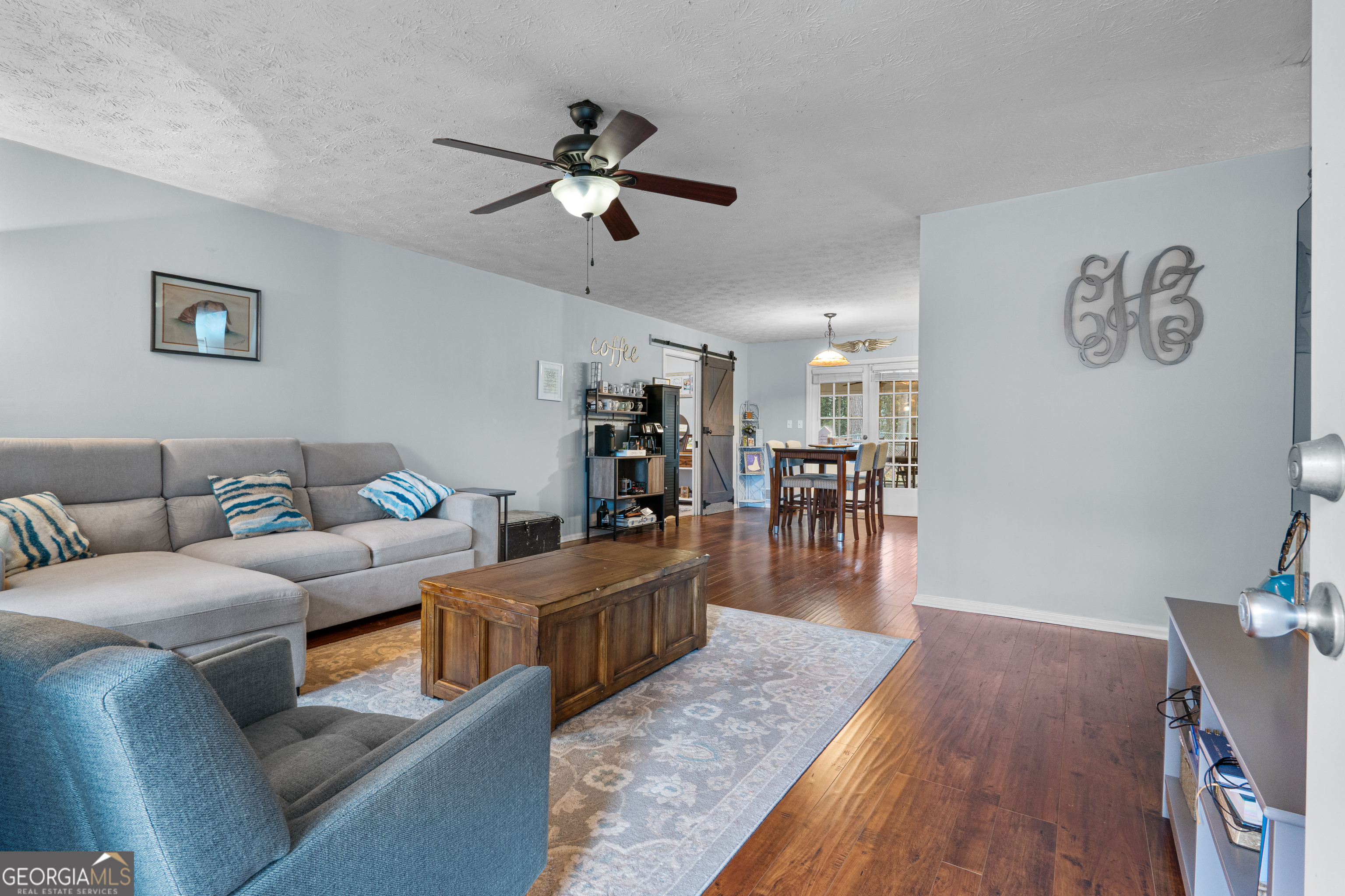 861 Bonner Road Carrollton, GA 30117 - Photo 9 of 38 a living room with furniture and a wooden floor