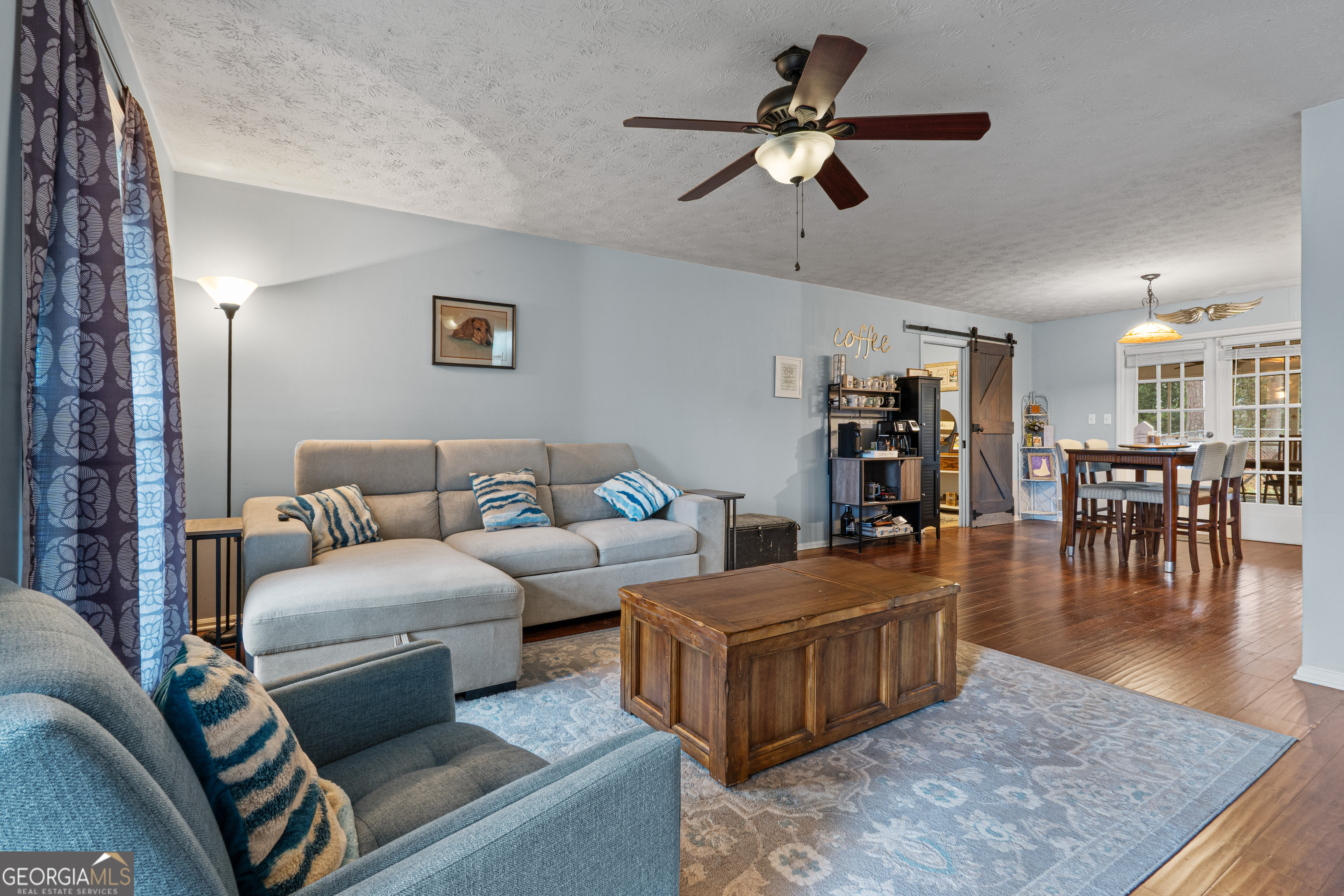 861 Bonner Road Carrollton, GA 30117 - Photo 10 of 38 a living room with furniture wooden floor and a ceiling fan