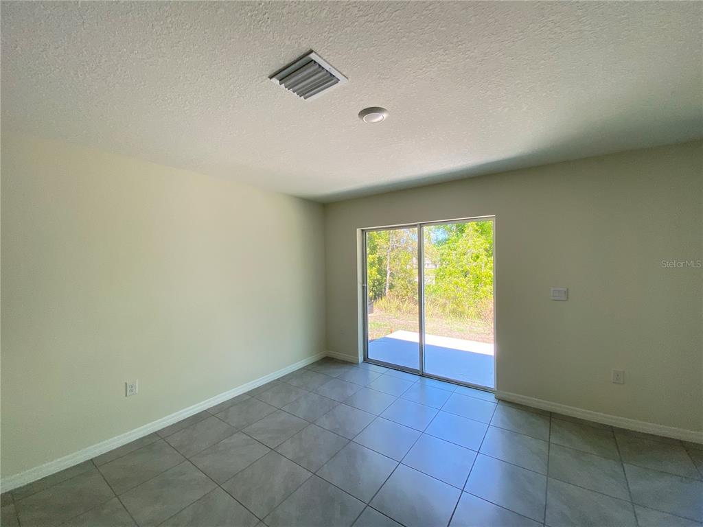 492 Hickory Course Loop Ocala, FL 34472 - Photo 11 of 28 a view of an empty room with a window