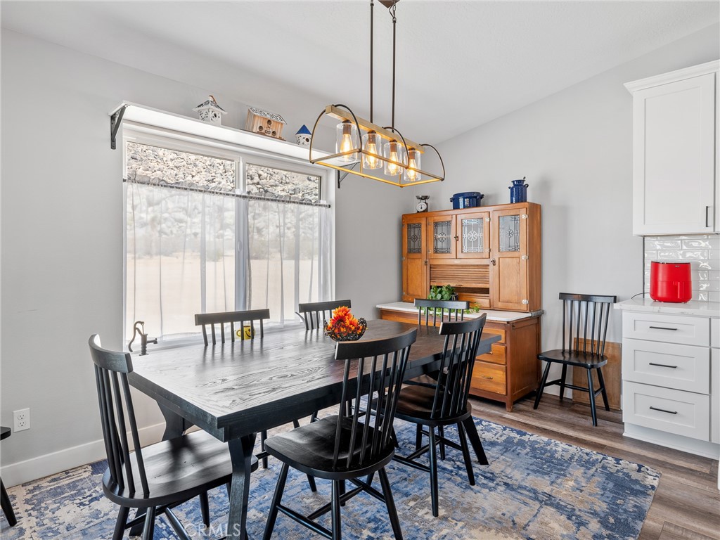 24162 Shoshone Road Apple Valley, CA 92307 - Photo 10 of 38 Large dining area off of kitchen with backyard views through picture window