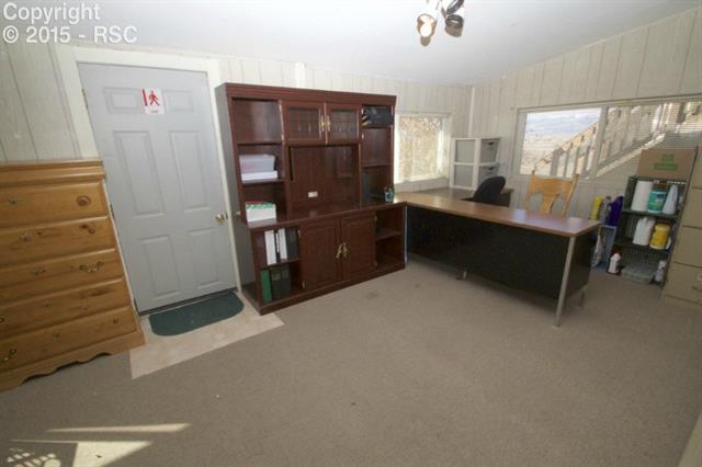11875 Smith Road Peyton, CO 80831 - Photo 17 of 26 Fully enclosed porch makes a great office