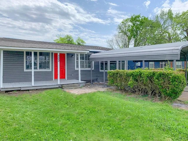 front view of a house with a yard