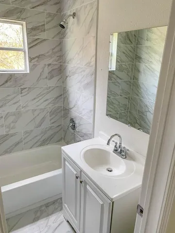 a bathroom with a sink and a bathtub
