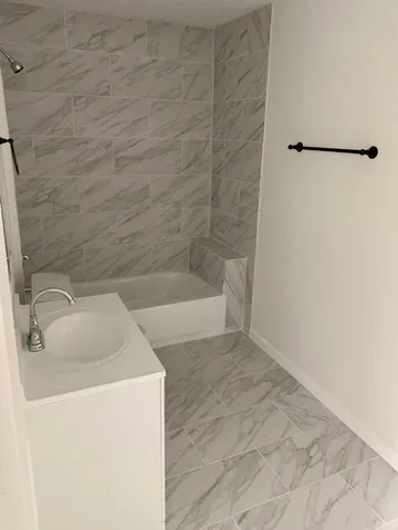 a bathroom with a sink and a shower