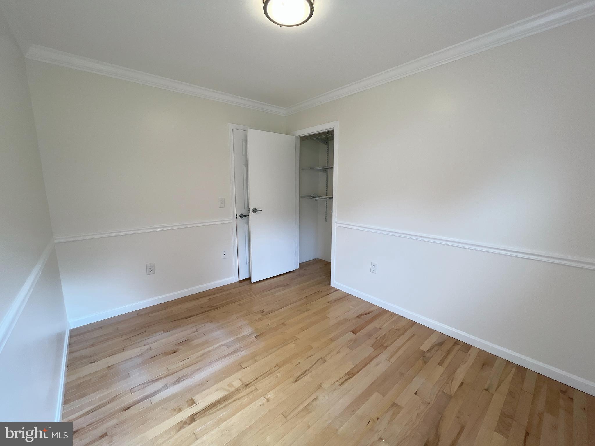 982 Shore Acres Road Arnold, MD 21012 - Photo 13 of 26 a view of an empty room with wooden floor