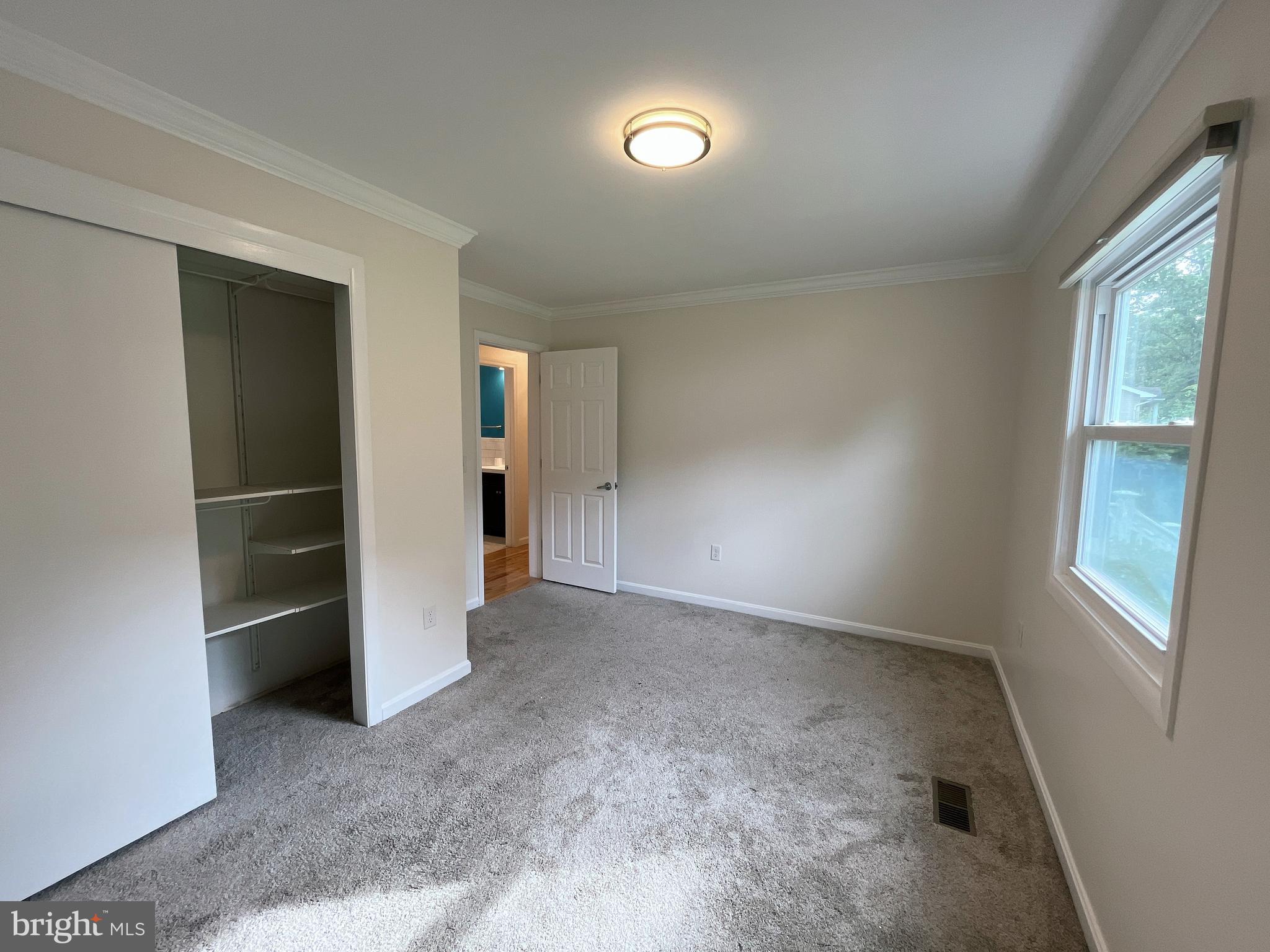 982 Shore Acres Road Arnold, MD 21012 - Photo 15 of 26 an empty room with closet and windows