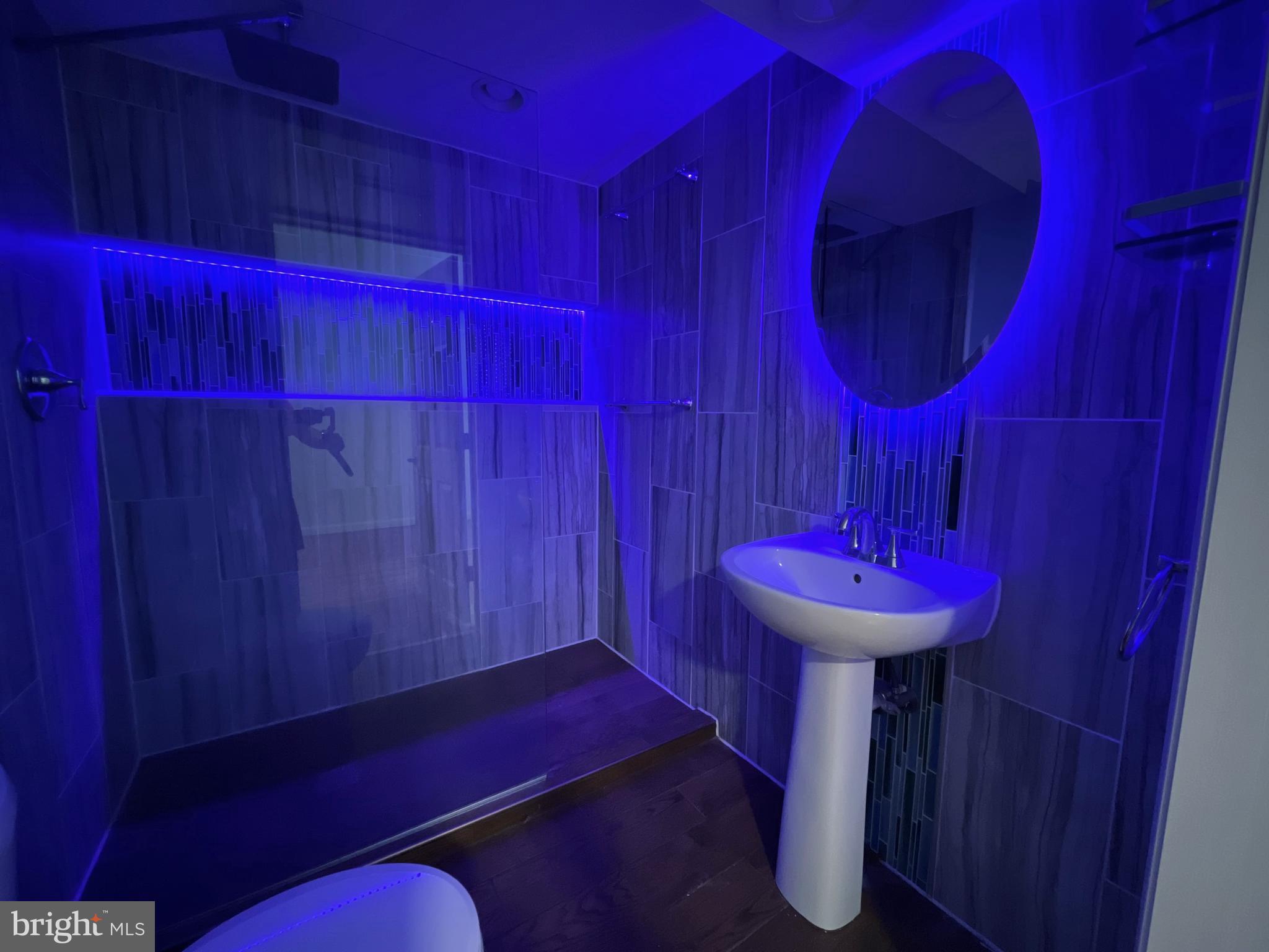 982 Shore Acres Road Arnold, MD 21012 - Photo 20 of 26 a bathroom with a sink and a mirror