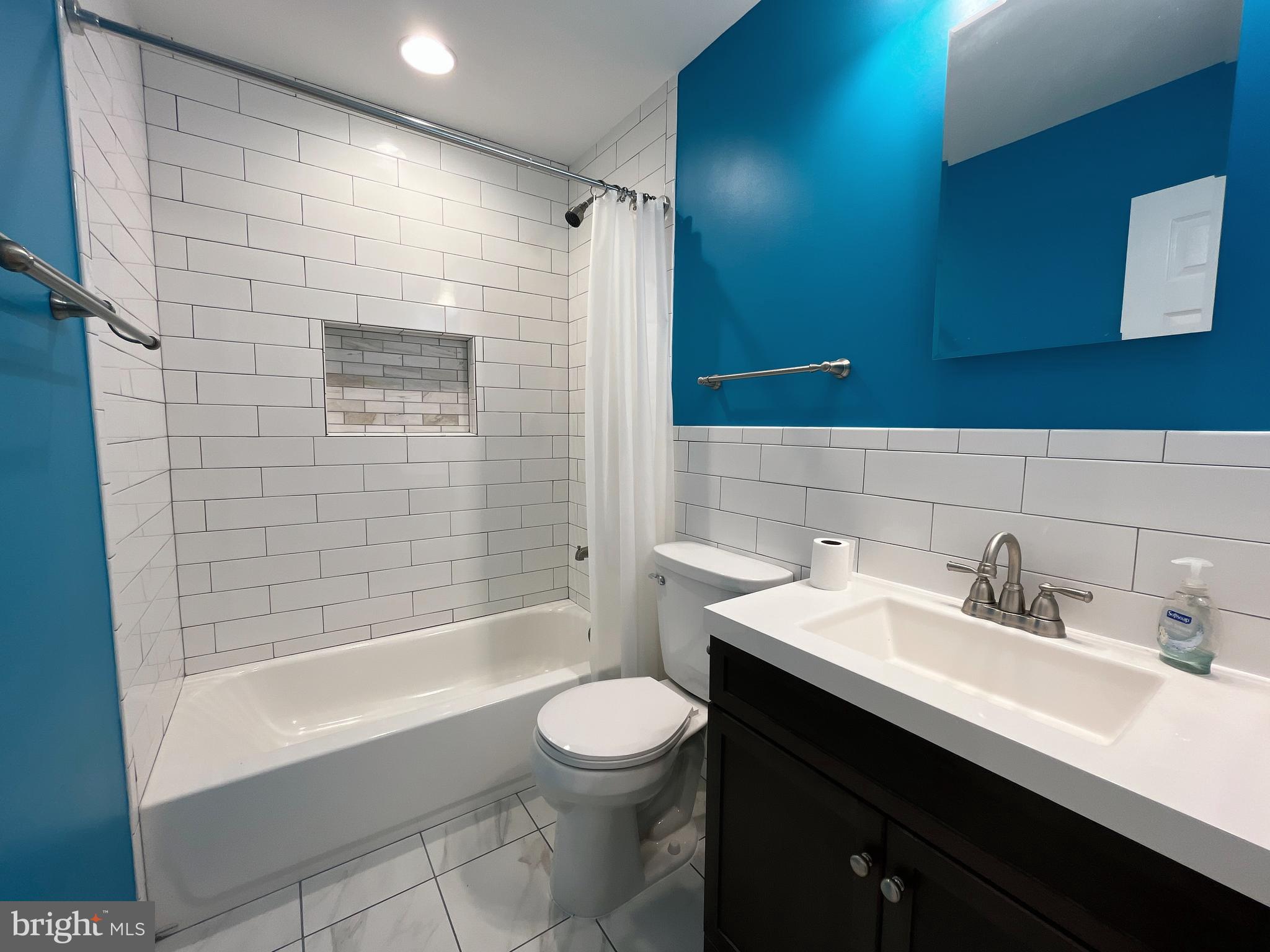 982 Shore Acres Road Arnold, MD 21012 - Photo 25 of 26 a bathroom with a sink a toilet and shower