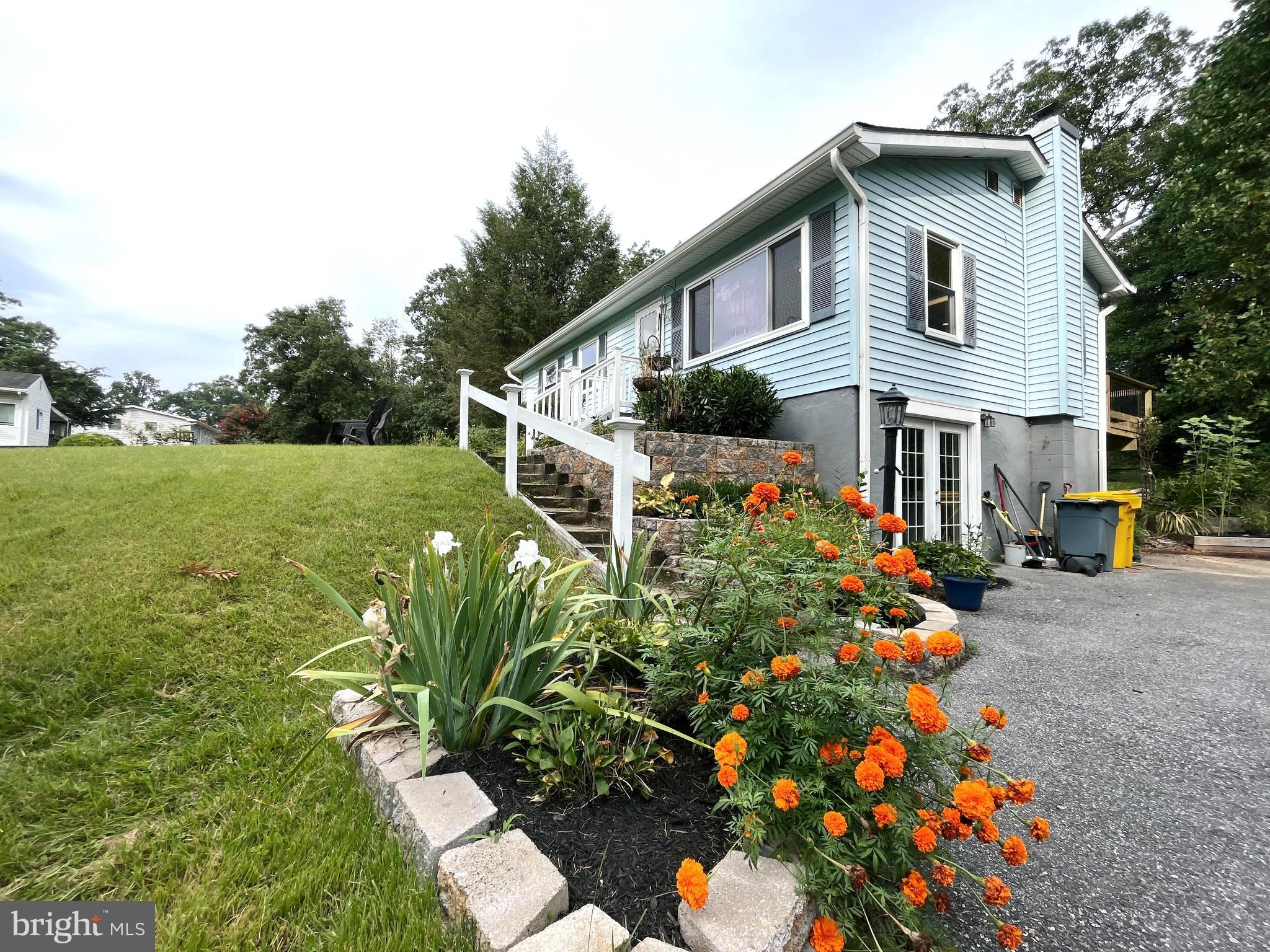 982 Shore Acres Road Arnold, MD 21012 - Photo 6 of 26 front view of a house with a yard