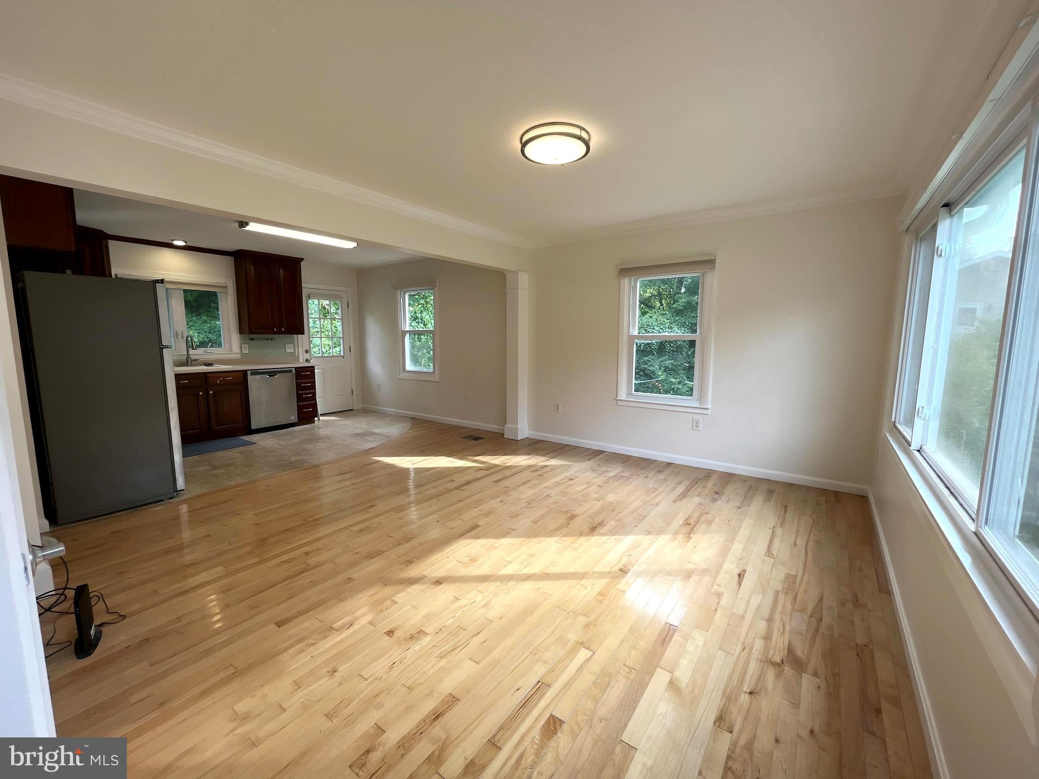 982 Shore Acres Road Arnold, MD 21012 - Photo 10 of 26 a view of empty room with a kitchen and a window