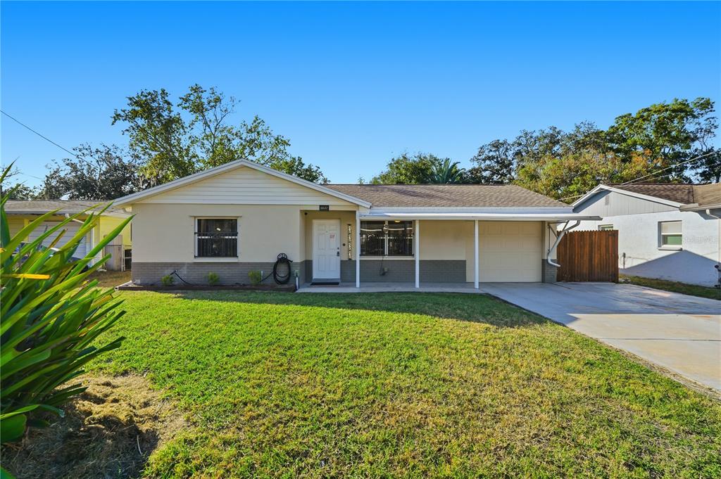 6637 Doon Street New Port Richey, FL 34653 - Photo 1 of 1 a front view of house with yard and seating area
