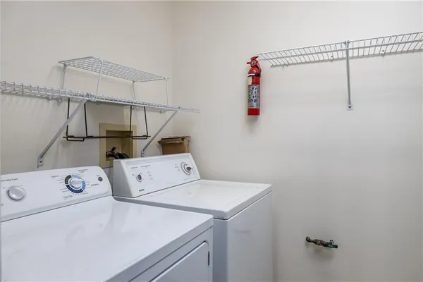 a utility room with dryer and washer
