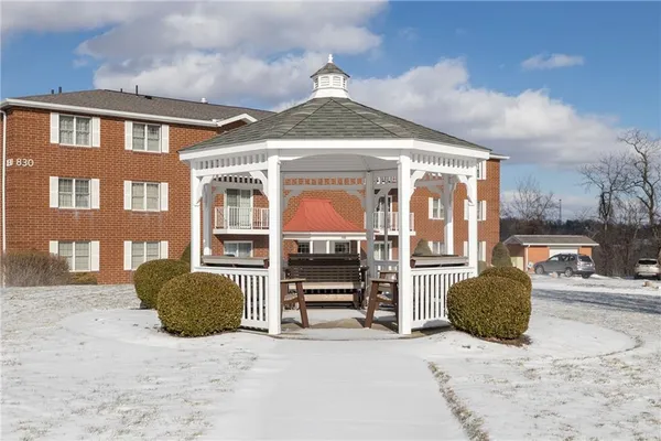 a front view of a house with parking space