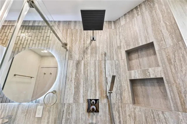 a bathroom with a toilet a sink and a mirror