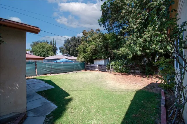 a view of a backyard of the house