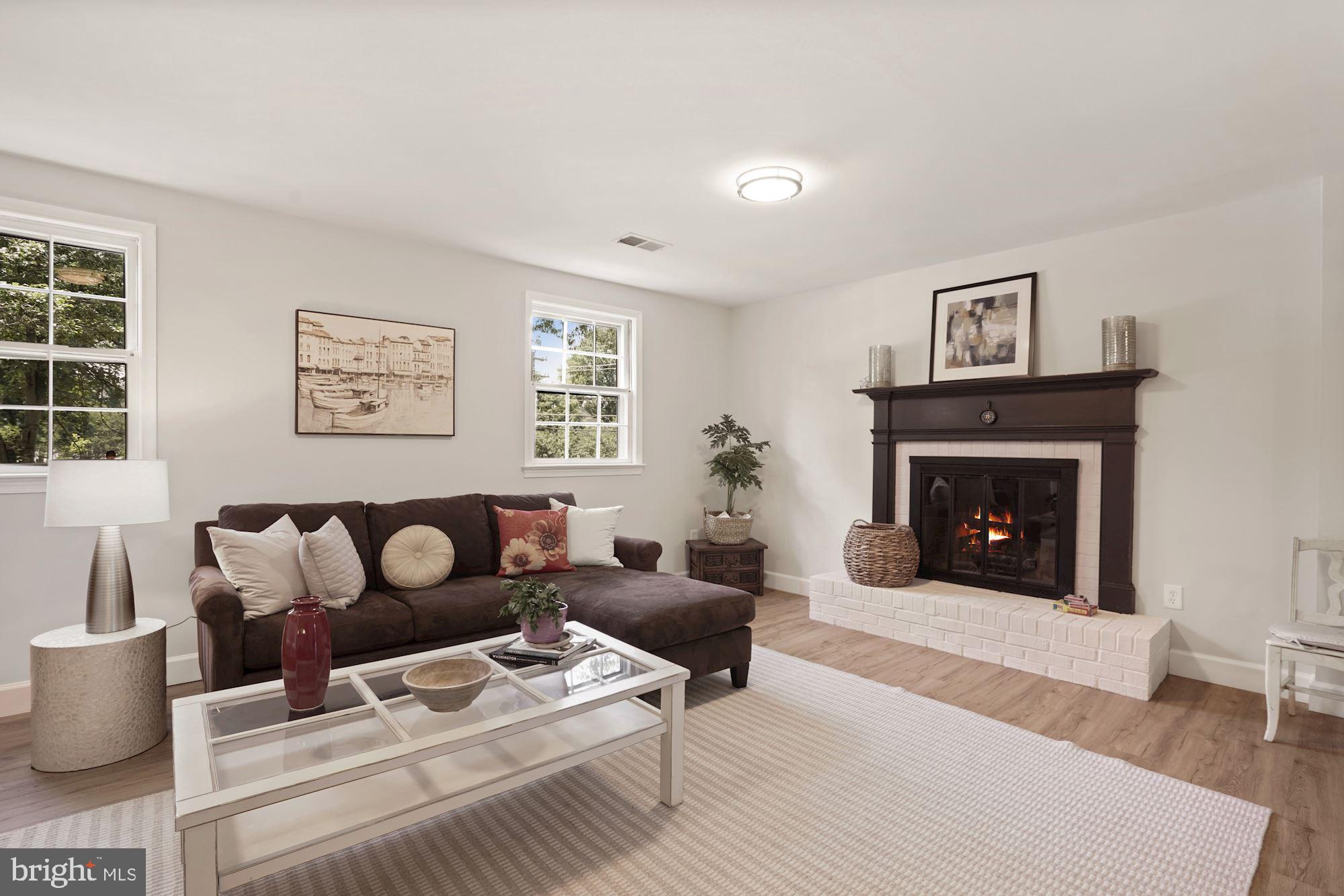 2104 Old Stage Road Alexandria, VA 22308 - Photo 24 of 39 Sunny Family room with fireplace faces south