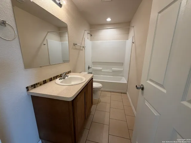 a bathroom with a sink a vanity and a mirror