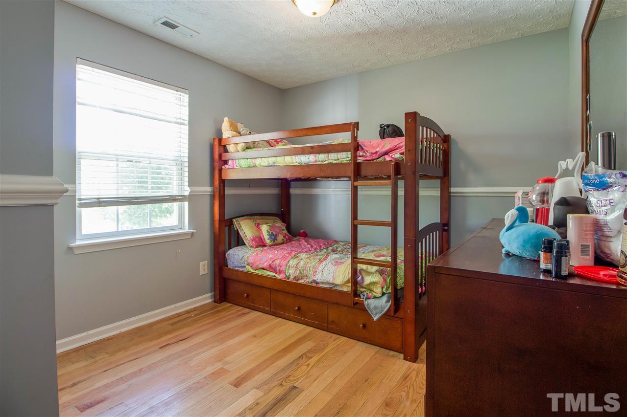 5729 Forest Point Road Raleigh, NC 27610 - Photo 14 of 26 a bedroom with bunk bed and a window